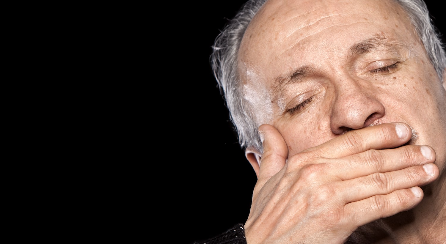 older-man-covering-mouth (1)